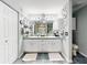 Updated bathroom with white cabinets, dual vanities, and tiled flooring at 8327 Sw 79Th Cir, Ocala, FL 34476
