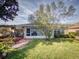 Exterior view of home with enclosed porch, walkway, and grassy yard at 8327 Sw 79Th Cir, Ocala, FL 34476