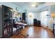 Home office with wood floors, ample natural light, and built-in storage at 8327 Sw 79Th Cir, Ocala, FL 34476