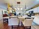 Updated kitchen with white cabinets, breakfast bar, and stainless steel appliances at 8327 Sw 79Th Cir, Ocala, FL 34476