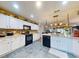 Modern kitchen with white cabinets, stainless steel appliances, and an island at 8327 Sw 79Th Cir, Ocala, FL 34476