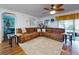 Inviting living room featuring plush sectional sofa and backyard views at 8327 Sw 79Th Cir, Ocala, FL 34476