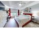 Spacious main bedroom with red headboard, ceiling fan, and large window at 8327 Sw 79Th Cir, Ocala, FL 34476