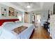 Large main bedroom with a king-size bed, ceiling fan, and ensuite bathroom access at 8327 Sw 79Th Cir, Ocala, FL 34476