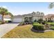 Inviting one-story residence with a paver driveway and lush landscaping at 8585 Sw 82Nd Ter, Ocala, FL 34481