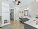 Double vanity bathroom with walk-in shower and grey cabinets at 8992 Sw 86Th Loop, Ocala, FL 34481