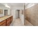 Bathroom boasts double vanity and walk-in shower at 9733 Sw 74Th Pl, Ocala, FL 34481