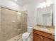 Bathroom with shower and granite vanity at 9733 Sw 74Th Pl, Ocala, FL 34481
