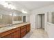 Elegant bathroom with granite countertop and double sinks at 9733 Sw 74Th Pl, Ocala, FL 34481