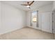 Well-lit bedroom featuring ceiling fan and window at 9733 Sw 74Th Pl, Ocala, FL 34481