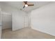 Bedroom with ceiling fan, closet, and access to bathroom at 9733 Sw 74Th Pl, Ocala, FL 34481
