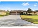 Two-story house with three car garage and a spacious yard at 9733 Sw 74Th Pl, Ocala, FL 34481