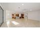 Open kitchen with island, stainless steel appliances, and wood cabinets at 9733 Sw 74Th Pl, Ocala, FL 34481