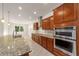 Open concept kitchen featuring a large island and stainless steel appliances at 9733 Sw 74Th Pl, Ocala, FL 34481