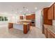 Modern kitchen with granite countertops and wood cabinets at 9733 Sw 74Th Pl, Ocala, FL 34481
