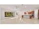 Open concept kitchen with island, stainless steel appliances, and wood cabinets at 9733 Sw 74Th Pl, Ocala, FL 34481