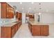 Kitchen with granite countertop island and wood cabinets at 9733 Sw 74Th Pl, Ocala, FL 34481