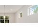 Bright kitchen featuring a pendant light and multiple windows at 9733 Sw 74Th Pl, Ocala, FL 34481