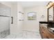 Bathroom with walk-in shower and marble flooring at 9901 Nw 6Th Ct, Ocala, FL 34475