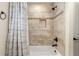 Tiled bathtub and shower with neutral color scheme at 9901 Nw 6Th Ct, Ocala, FL 34475
