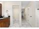 Main bathroom with toilet and marble floor at 9901 Nw 6Th Ct, Ocala, FL 34475
