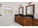 Elegant bathroom with double vanity and granite countertop at 9901 Nw 6Th Ct, Ocala, FL 34475
