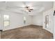 Spacious bedroom with plush carpet and access to backyard at 9901 Nw 6Th Ct, Ocala, FL 34475