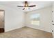 Spacious bedroom with window and ceiling fan at 9901 Nw 6Th Ct, Ocala, FL 34475