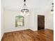 Elegant dining room with hardwood floors and a large window at 9901 Nw 6Th Ct, Ocala, FL 34475