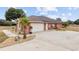 Attached garage with solar panels and landscaping at 9901 Nw 6Th Ct, Ocala, FL 34475