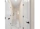 Clean hallway with white doors and marble tile floor at 9901 Nw 6Th Ct, Ocala, FL 34475