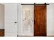 Bright hallway with marble floors and barn door at 9901 Nw 6Th Ct, Ocala, FL 34475