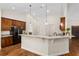 Open concept kitchen with breakfast bar and hardwood floors at 9901 Nw 6Th Ct, Ocala, FL 34475