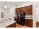 Kitchen boasts stainless steel refrigerator and wood cabinets at 9901 Nw 6Th Ct, Ocala, FL 34475