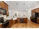 Modern kitchen with stainless steel appliances and farmhouse sink at 9901 Nw 6Th Ct, Ocala, FL 34475
