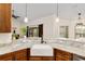 Kitchen features a farmhouse sink and granite countertops at 9901 Nw 6Th Ct, Ocala, FL 34475