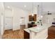 Open concept kitchen with island and hardwood floors at 9901 Nw 6Th Ct, Ocala, FL 34475