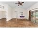 Spacious living area with hardwood floors, fireplace, and high ceilings at 9901 Nw 6Th Ct, Ocala, FL 34475