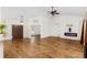 Open living space featuring hardwood floors and a modern fireplace at 9901 Nw 6Th Ct, Ocala, FL 34475
