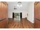 Spacious living area with hardwood floors and pool view at 9901 Nw 6Th Ct, Ocala, FL 34475