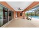 Covered patio with pool and fenced yard views at 9901 Nw 6Th Ct, Ocala, FL 34475