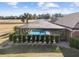 Screened pool and patio area with surrounding hedges at 9901 Nw 6Th Ct, Ocala, FL 34475