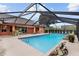 Refreshing screened pool perfect for outdoor enjoyment at 9901 Nw 6Th Ct, Ocala, FL 34475