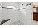 Large walk-in shower with marble tile and seat at 9901 Nw 6Th Ct, Ocala, FL 34475