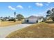 View of the home's side and driveway at 10110 Se 179Th St, Summerfield, FL 34491