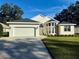 One-story home with a two-car garage and well-manicured lawn at 10654 Sw 71St Cir, Ocala, FL 34476