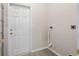 Small laundry room with white door, vinyl flooring, and hookups at 10654 Sw 71St Cir, Ocala, FL 34476