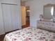 Spacious bedroom with floral bedding and ample closet space at 11495 Sw 138Th Ln, Dunnellon, FL 34432