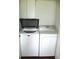 White washer and dryer in a laundry closet at 11495 Sw 138Th Ln, Dunnellon, FL 34432