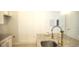 Kitchen with granite countertop, sink, and gold faucet at 1609 Chelsea Manor Cir, Deland, FL 32724